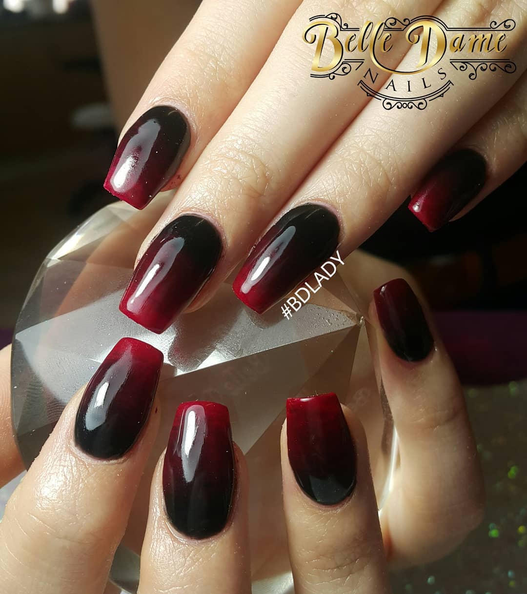 black nails with red gems